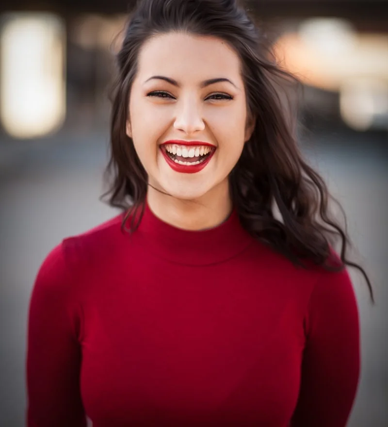 Anya, smiling in a red jumper: a designer from Saint Petersburg practising English on talksibi