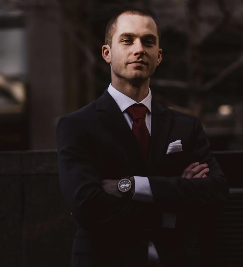 James, in a dark suit with his arms folded: a teacher from Manchester learning Russian on talksibi